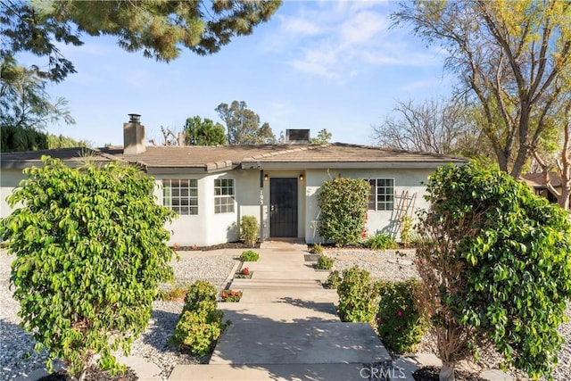 single story home featuring stucco siding
