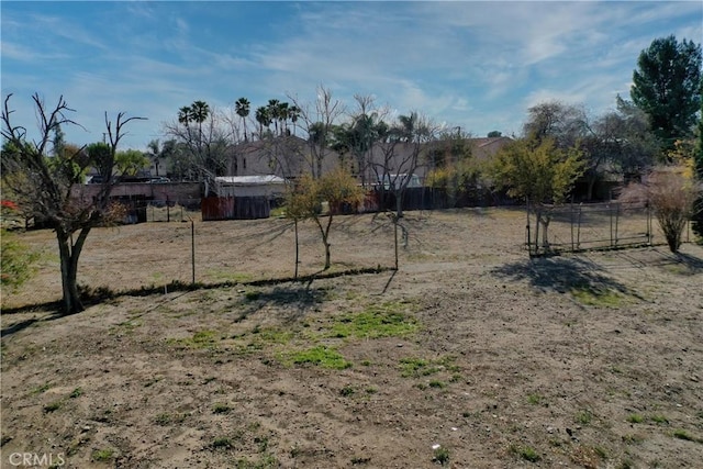 view of yard with fence and a gate