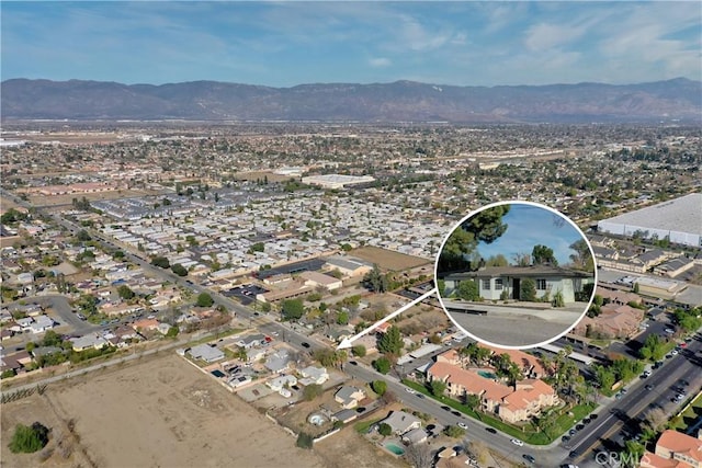 drone / aerial view with a residential view and a mountain view