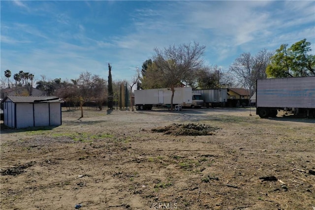 view of yard with a shed and an outdoor structure