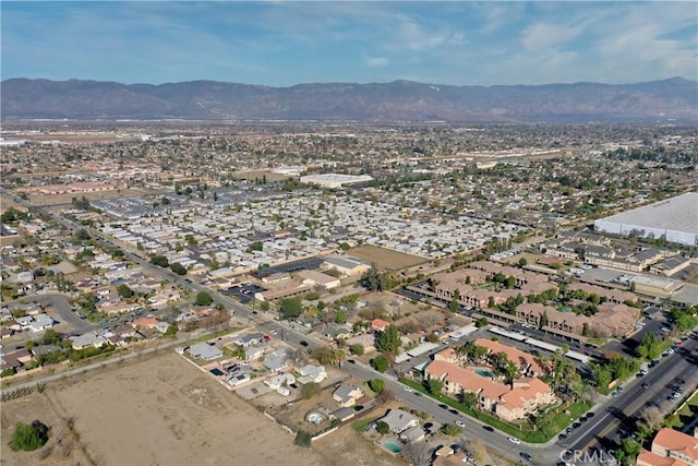 drone / aerial view featuring a residential view and a mountain view