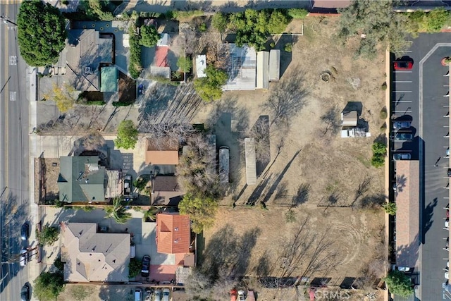 birds eye view of property with a residential view