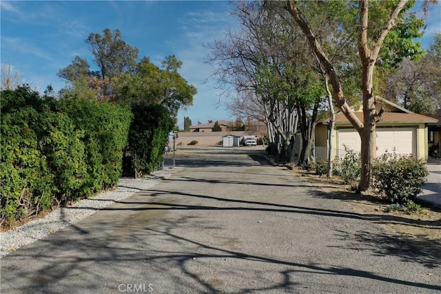 view of street with aphalt driveway