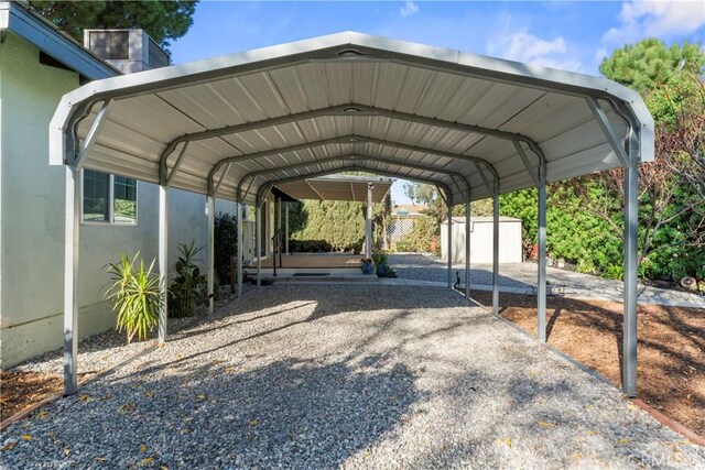 view of parking with a carport