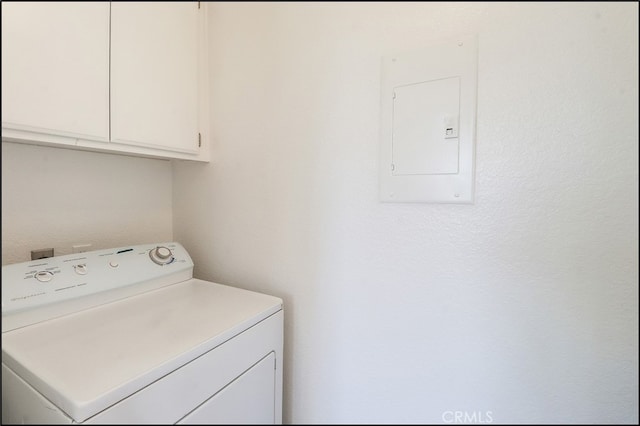 washroom featuring cabinets, washer / dryer, and electric panel