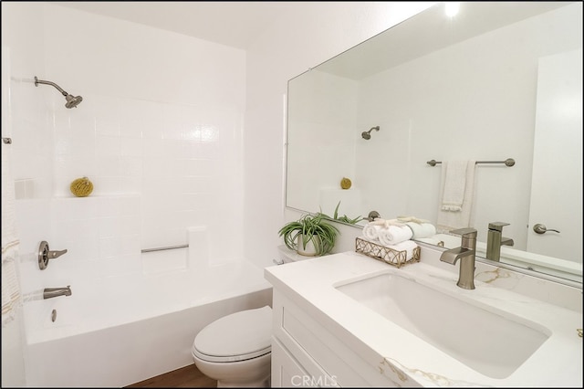 full bathroom with shower / bathing tub combination, vanity, and toilet