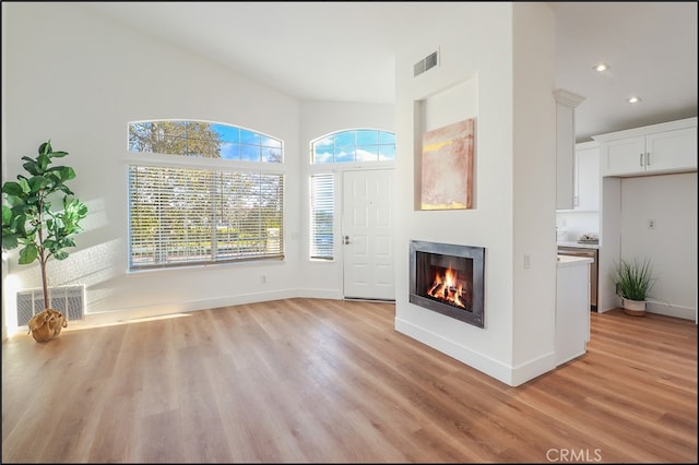 unfurnished living room with light hardwood / wood-style floors