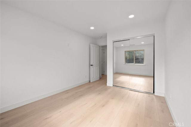 spare room featuring light hardwood / wood-style floors