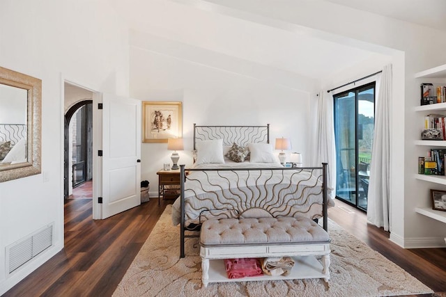 bedroom featuring dark hardwood / wood-style floors and access to outside