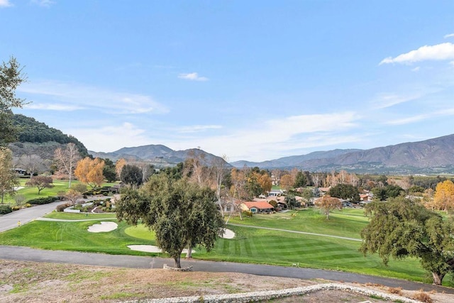 surrounding community with a mountain view