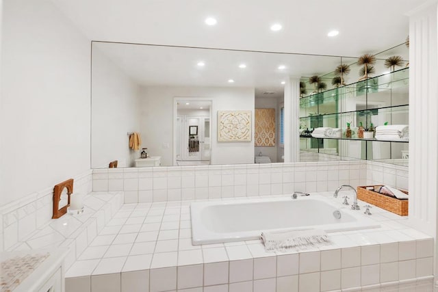 bathroom featuring a relaxing tiled tub