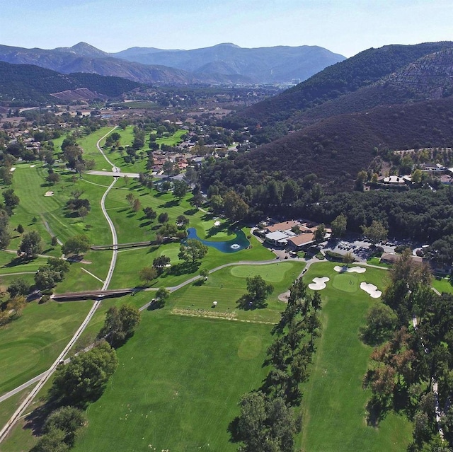 birds eye view of property with a mountain view