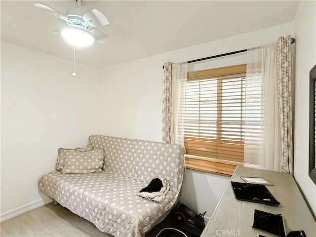 sitting room featuring ceiling fan and light wood-type flooring