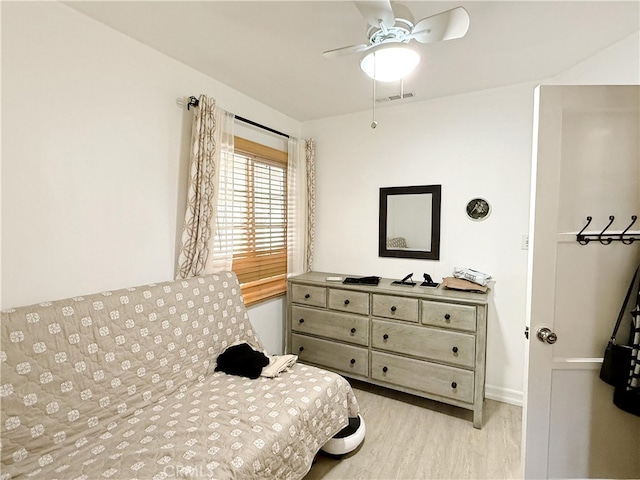 bedroom featuring light hardwood / wood-style floors and ceiling fan