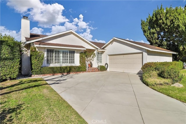 single story home with a garage and a front lawn