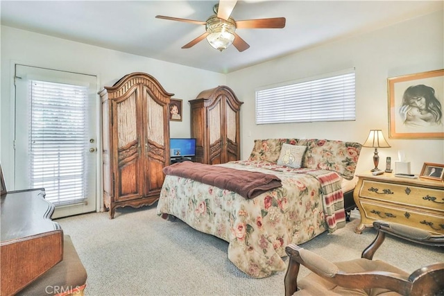 bedroom with light colored carpet and ceiling fan