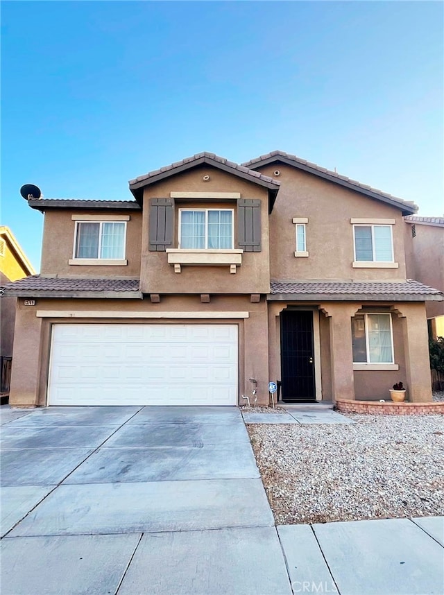 view of front of property featuring a garage