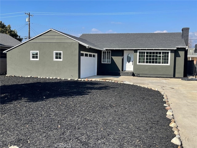 single story home featuring a garage