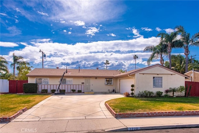 single story home with a garage and a front lawn