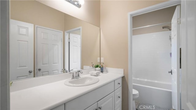 full bathroom featuring vanity, shower / washtub combination, and toilet