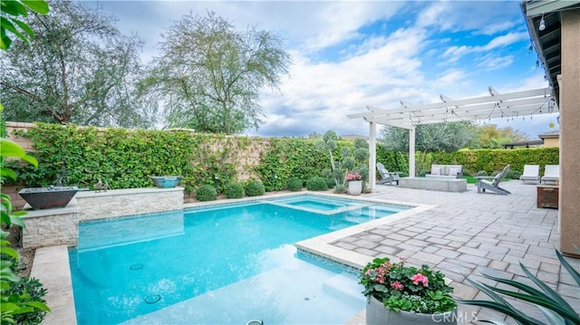 view of pool featuring an in ground hot tub, a patio area, and a pergola