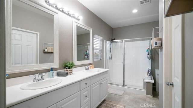 bathroom with vanity and an enclosed shower