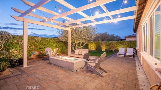 patio terrace at dusk featuring a pergola and an outdoor living space with a fire pit