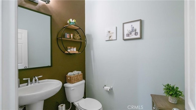 bathroom with sink and toilet