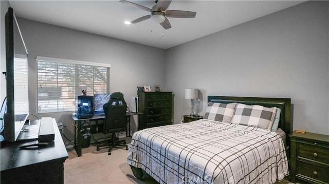 bedroom featuring light colored carpet and ceiling fan