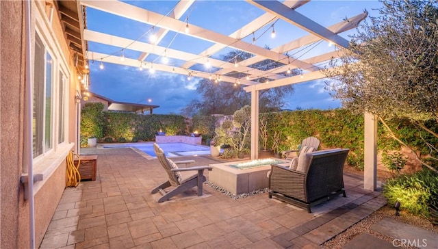 patio terrace at dusk featuring a pergola and an outdoor fire pit