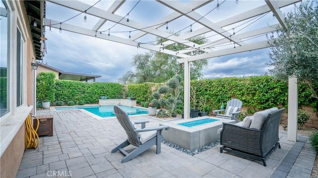 view of patio with a fenced in pool and an outdoor fire pit