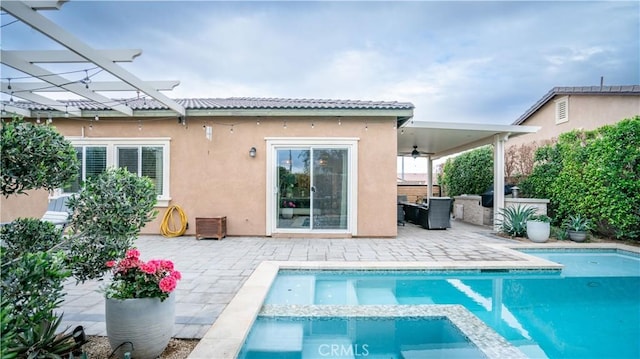 rear view of house with a pergola, ceiling fan, and a patio area