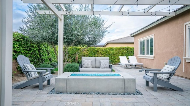 view of patio / terrace with a pergola and an outdoor living space with a fire pit