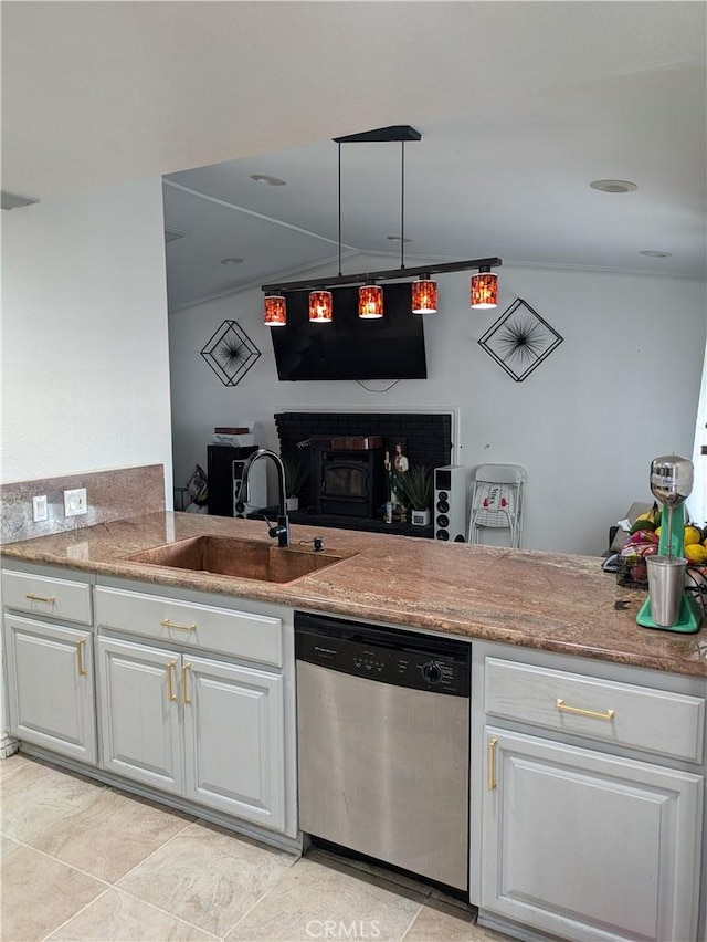 kitchen with white cabinetry, dishwasher, sink, and kitchen peninsula