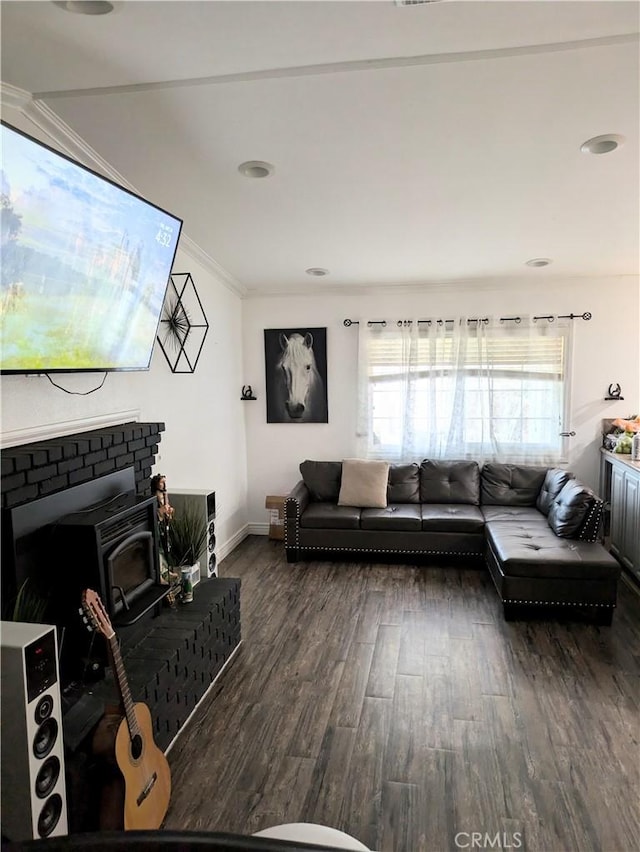 living room with dark wood-type flooring and ornamental molding