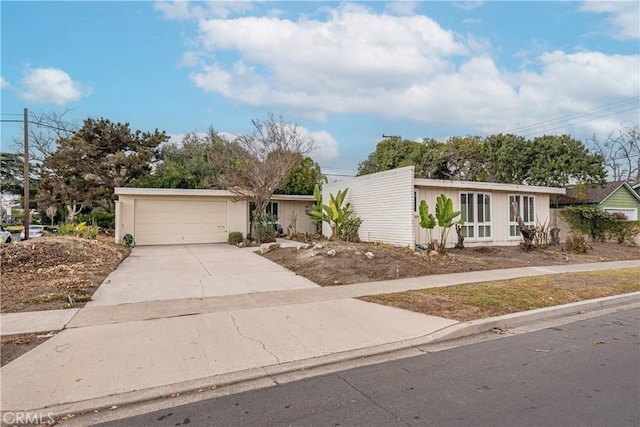 ranch-style home featuring a garage