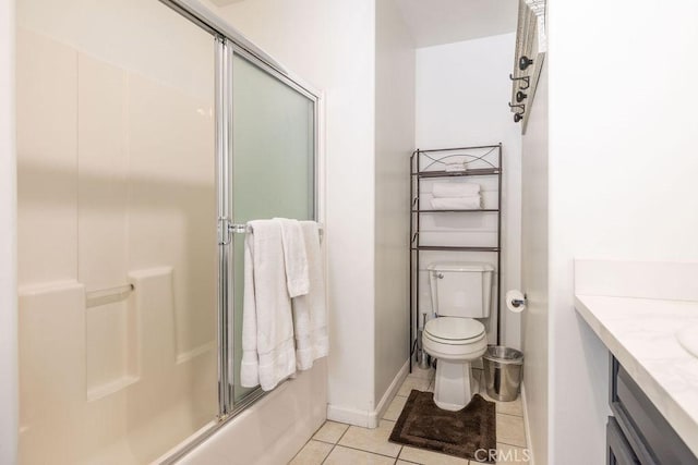 full bathroom with enclosed tub / shower combo, vanity, toilet, and tile patterned flooring