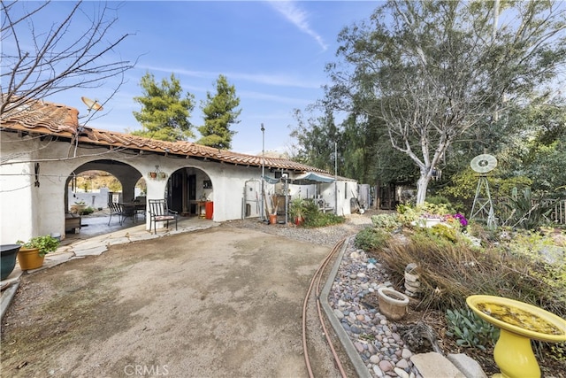 back of property with a patio area