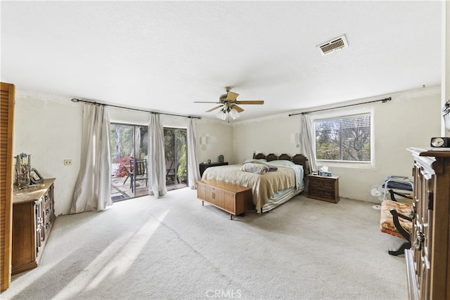 carpeted bedroom featuring ceiling fan and access to outside