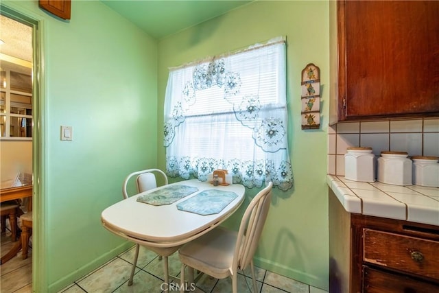 dining room featuring light tile patterned flooring