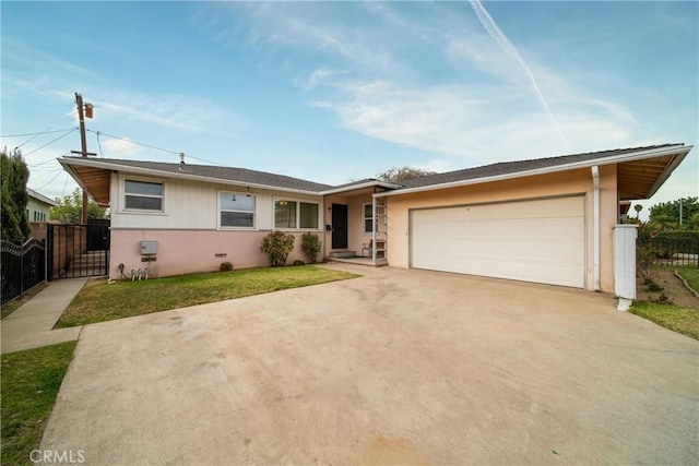 ranch-style house featuring a garage and a front yard