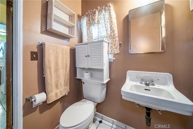 bathroom with sink and toilet