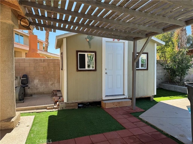 view of outbuilding with a pergola