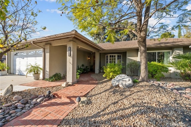 ranch-style home featuring a garage