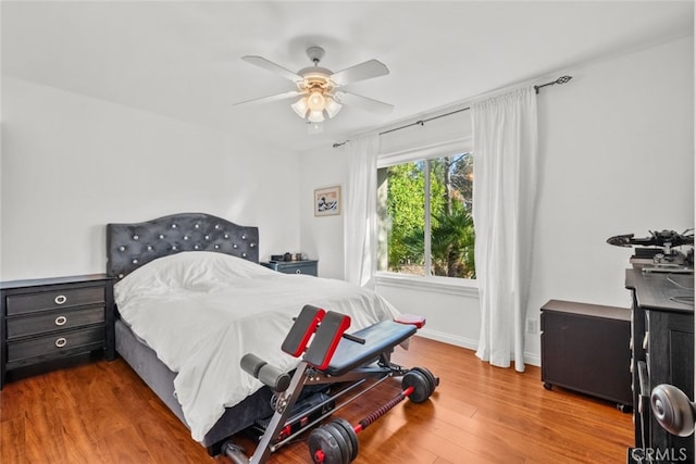 bedroom with hardwood / wood-style flooring and ceiling fan