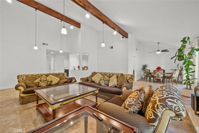 living room featuring beamed ceiling, ceiling fan, and high vaulted ceiling