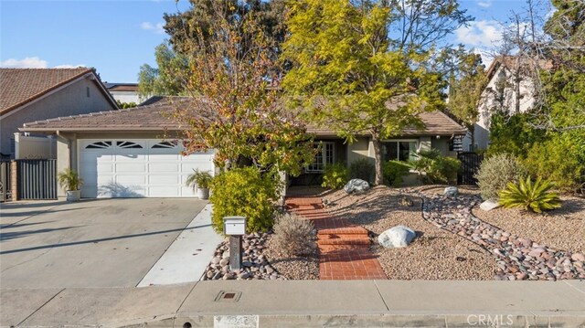 single story home featuring a garage