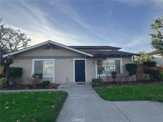 single story home with a front yard