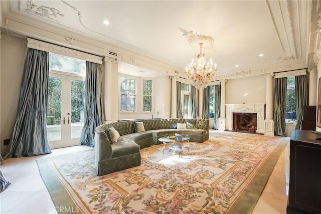 tiled living room with french doors, a fireplace, a healthy amount of sunlight, and crown molding