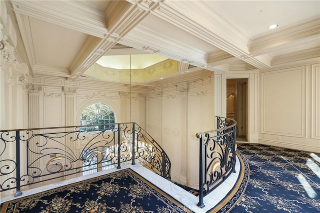 hall featuring beamed ceiling, crown molding, and coffered ceiling